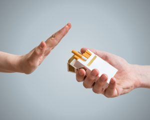 person refusing cigarette showing what happens when you quit smoking